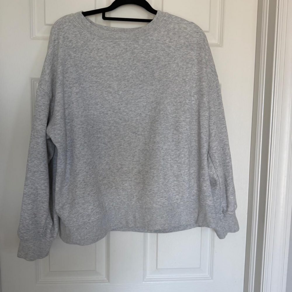 Soft heather gray Fabletics sweatshirt with an oversized, relaxed fit. Features